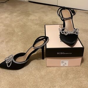 BCBG Hartense Black satin, Rhinestone bow tie/ankle strap, 4” heel, worn once